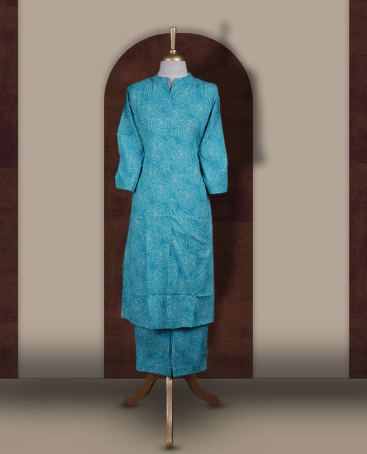 Sky blue colour coord set featuring elegant floral prints all over, mandarin collar, and sheer 3/4 sleeves, Paired with matching pants, it offers a sleek, modern look perfect for refined casual wear.
