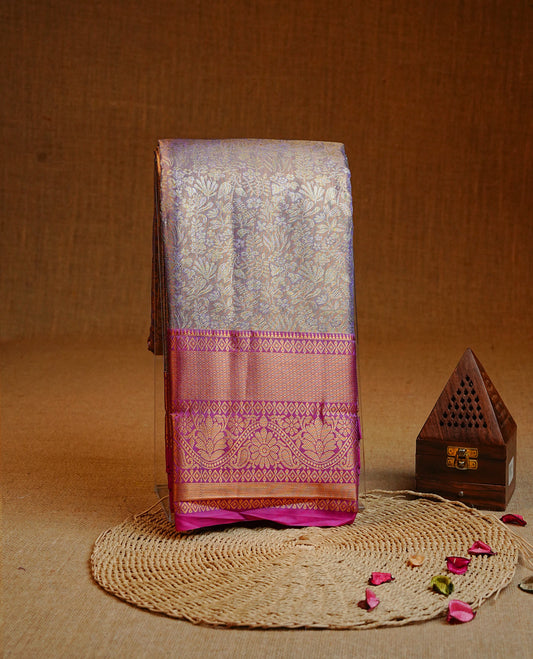 Purple & gold colour Double shade Semi tissue silk saree featuring Gold & silver kodi with Pattern on body, Contrast Magenta colour with traditional border, paired with matching.