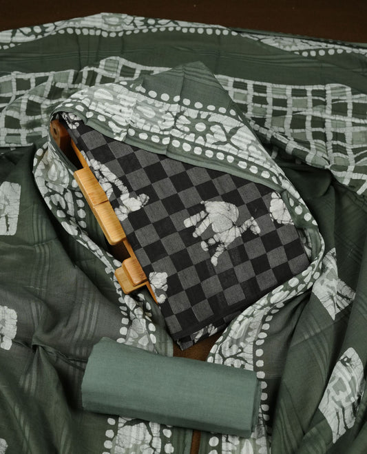 Black colour churidar material featuring a checked printed body with subtle motifs, paired with a matching bottom and coordinated printed dupatta.