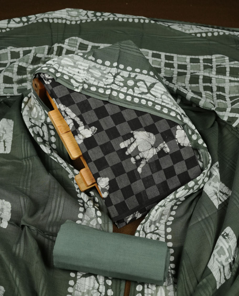 Black colour churidar material featuring a checked printed body with subtle motifs, paired with a matching bottom and coordinated printed dupatta.