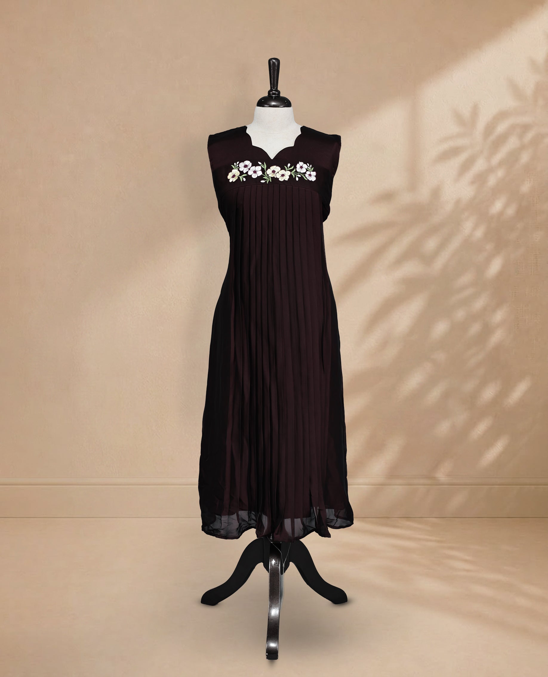 Dark Chocolate Coloured Sleeveless Kurti Featuring a Designed Neckline, Floral Embroidery on the Body