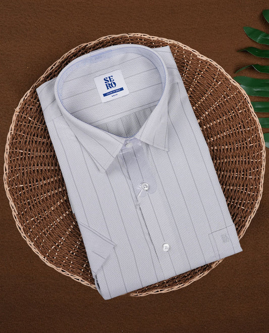 Light grey colour short sleeve shirt featuring an intricate vertical stripes, Made from smooth, lightweight fabric with a subtle sheen. Includes a classic collar and button down front.