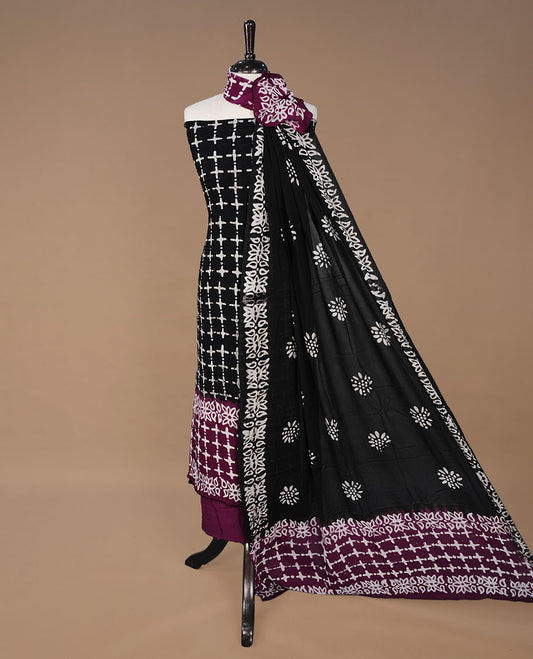 Purple and Black colour churidhar material featuring cream colour floral kodi print on body, paired with matching bottom and Dupatta.