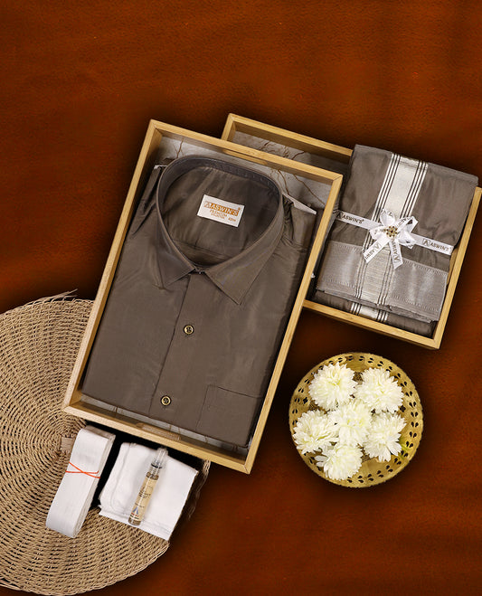 Copper colour Aswin’s wedding set featuring a premium silk finish full sleeve shirt, paired with a matching dhoti and angavastram accented with elegant silver zari work, ideal for festive and wedding occasions