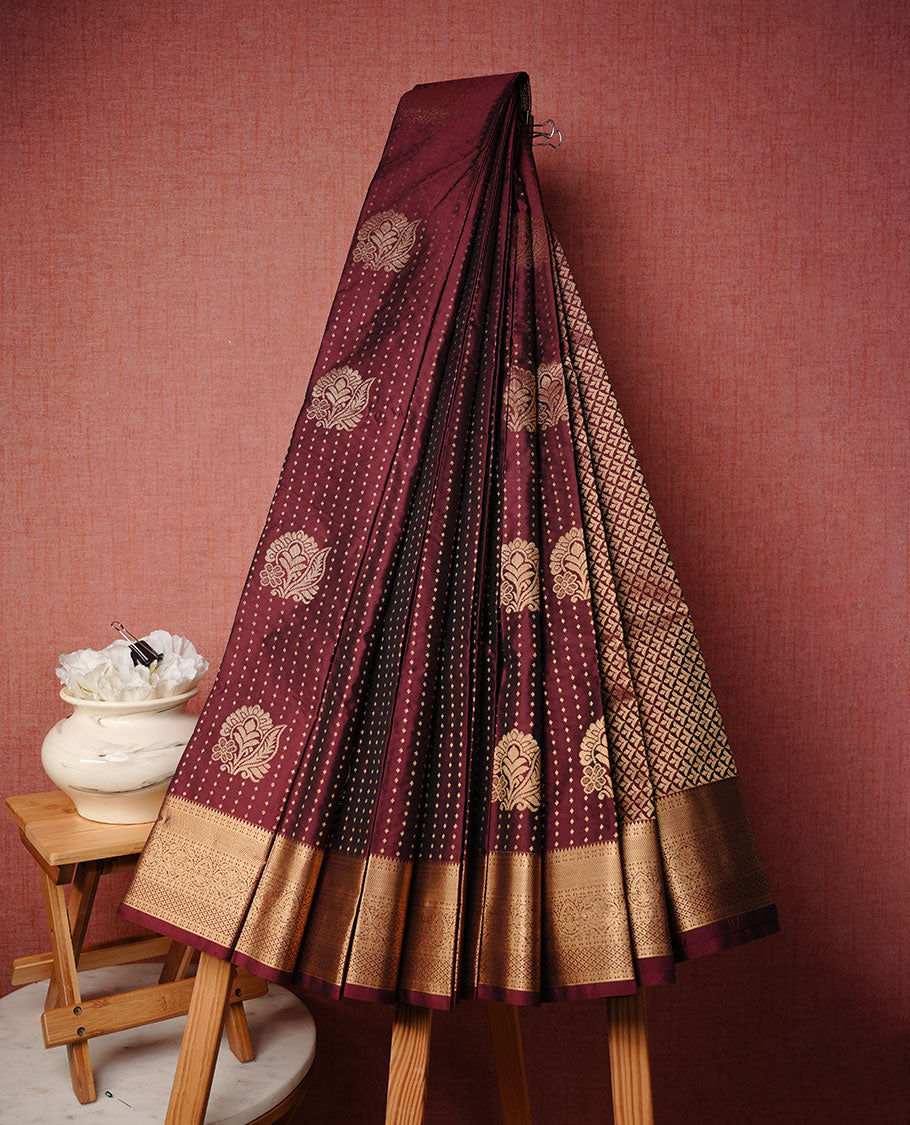 Brown colour soft silk saree featuring Gold zari dotted stripes & motifs on body, complemented by self colour with traditional border, paired with matching blouse piece.