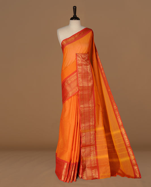 Orange Colour Chettinad cotton saree featuring Red motifs body , complemented by contrast Red colour with traditional border, comes with matching blouse piece.