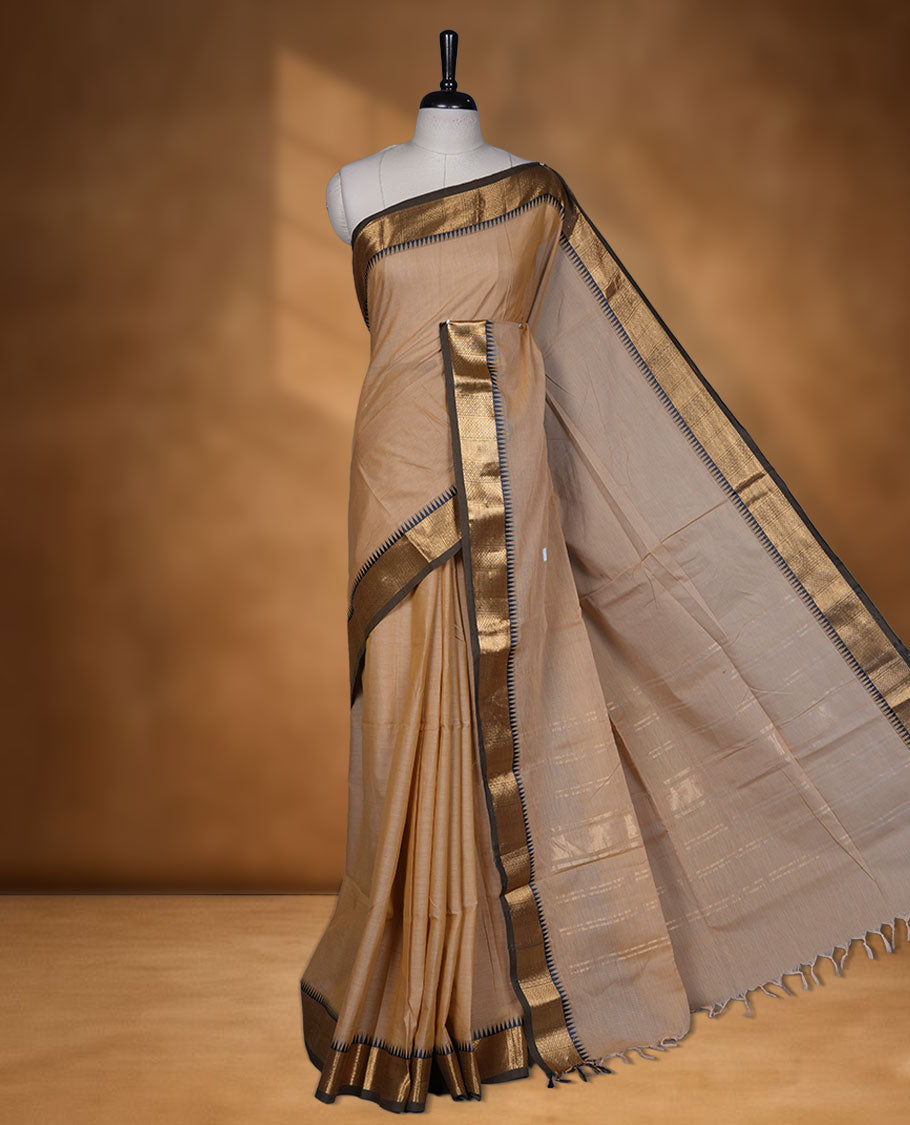 Sandal colour chettinad cotton saree featuring  Elegant plain body, contrast Black colour border with gold zari temple border, pallu and paired with matching blouse