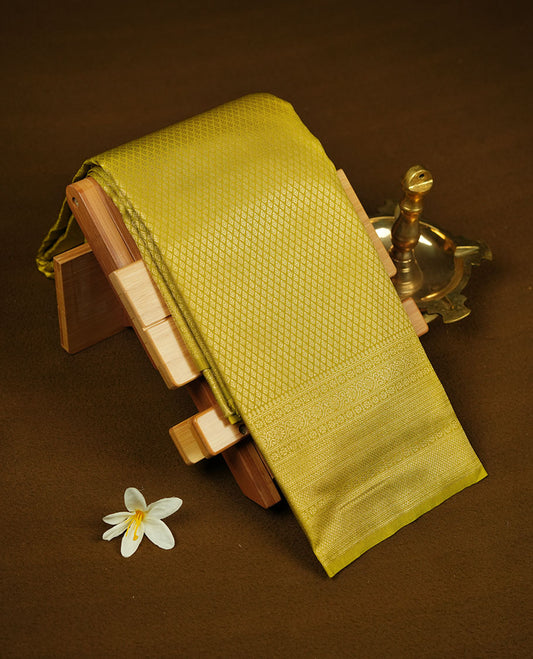 Lemon colour semi soft silk brocade saree with all-over fine geometric weave, detailed traditional pallu, and a matching blouse.