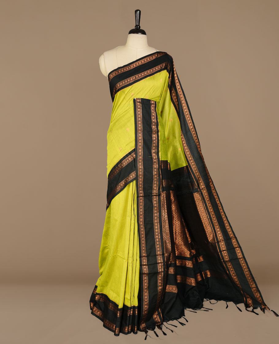 Lemon colour kalyani cotton saree featuring Elegant plain body, complemented by black colour with Antique zari border, paired with matching blouse piece.