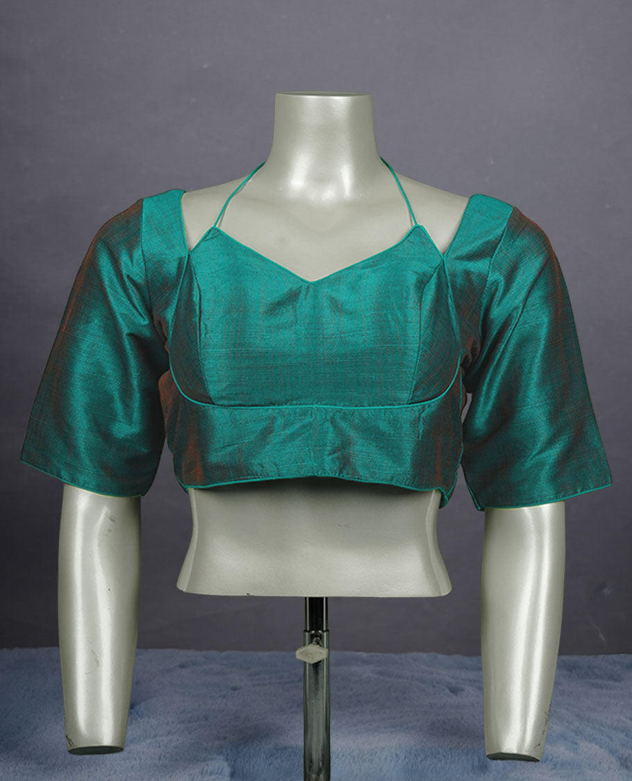 Teal green colour silk padded readymade blouse with elbow length sleeves, a V-neck front, and a deep U-back with tie-up dori.