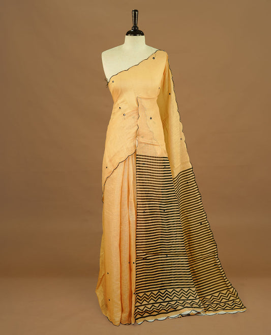Beige colour Semi Linen saree featuring mirror work with intricate thread detailing, enhanced by a stylish scallop border. Comes without a blouse piece.