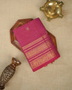 Magneta colour chettinad cotton saree Featuring Gold zari Check Pattern with motifs on body, complemented by Self colour with zari border, comes with matching blouse piece.