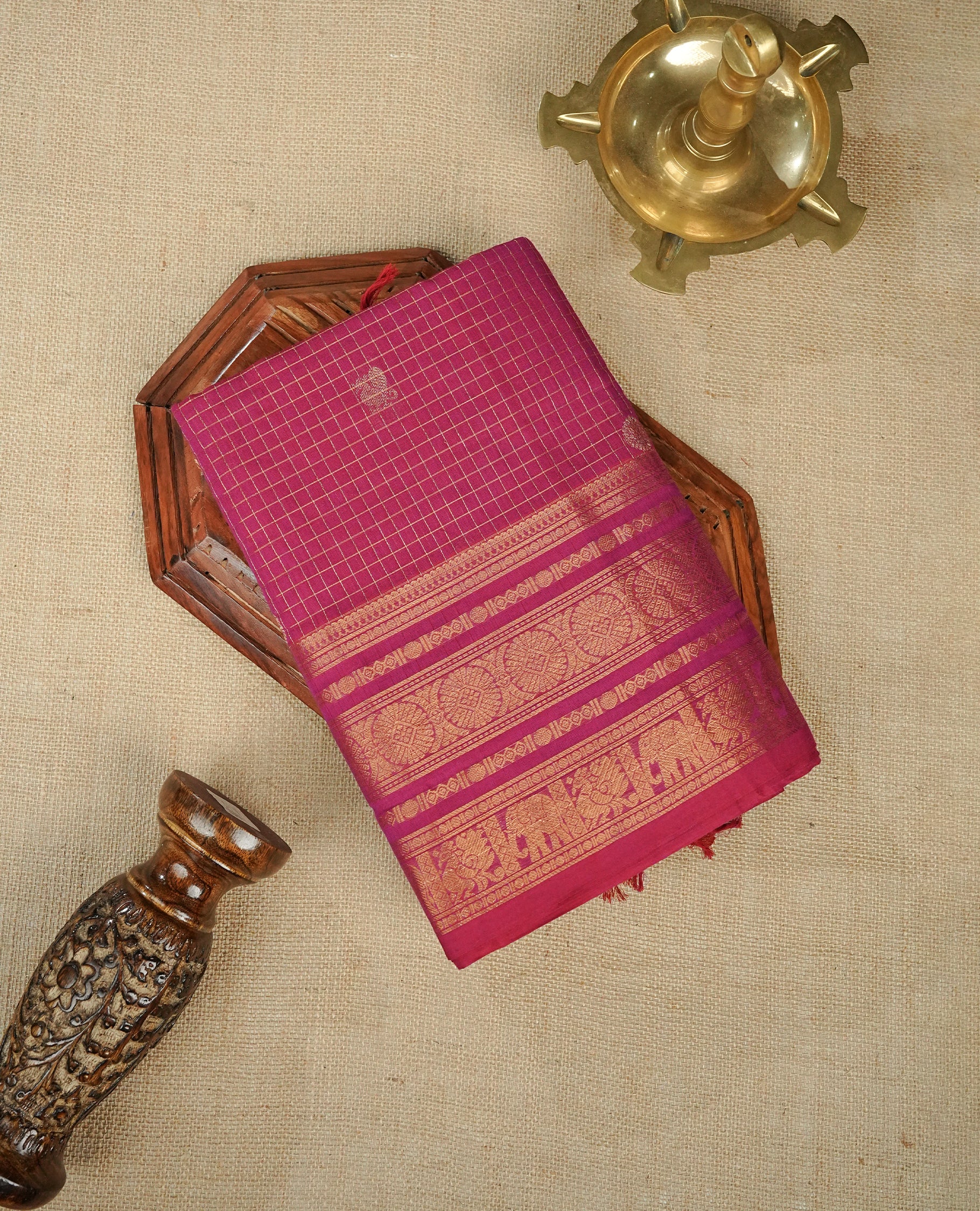 Magneta colour chettinad cotton saree Featuring Gold zari Check Pattern with motifs on body, complemented by Self colour with zari border, comes with matching blouse piece.