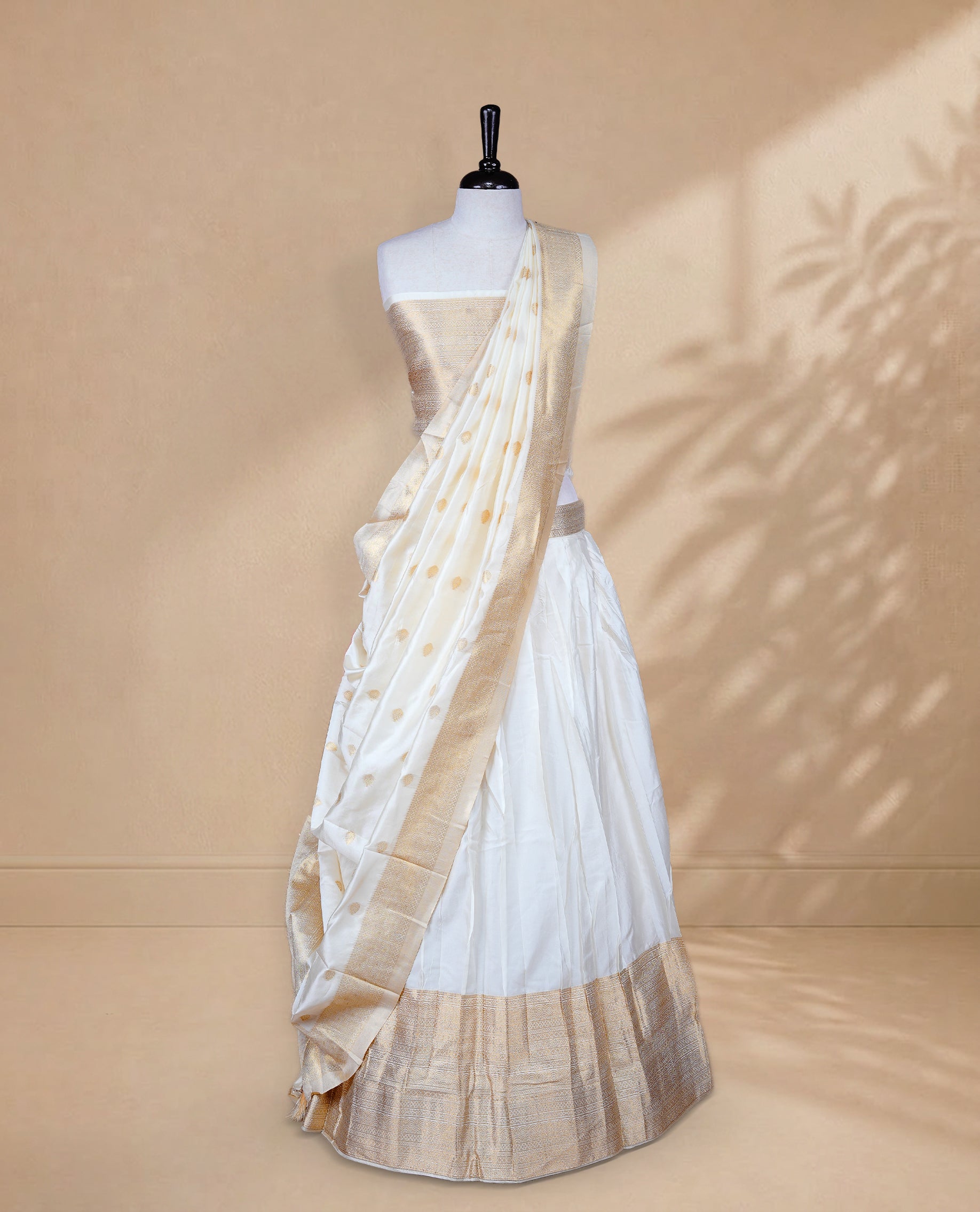 Cream colour Half saree featuring Plain skirt with Zari border on Self colour border, Unstitched Blouse and matching dupatta.