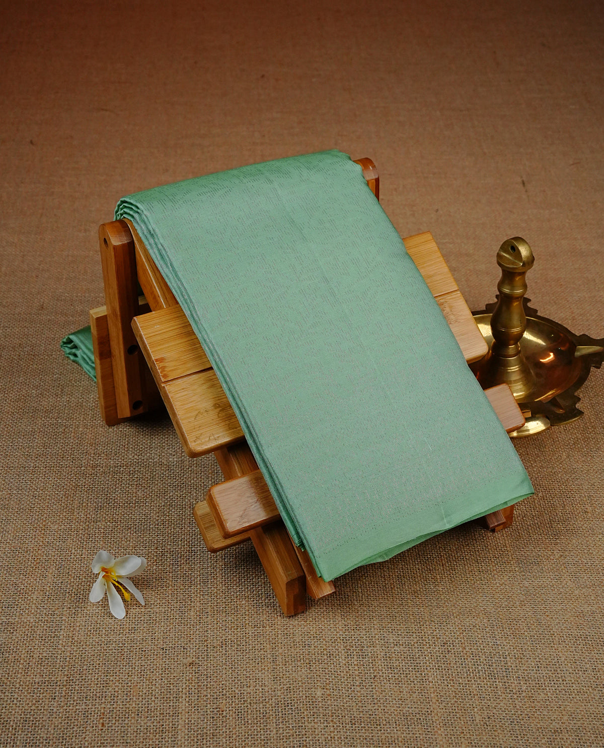 Mint Green Colour soft silk saree featuring elegant Zari Work across the body, complemented by a matching self design pallu, paired with a matching blouse piece.