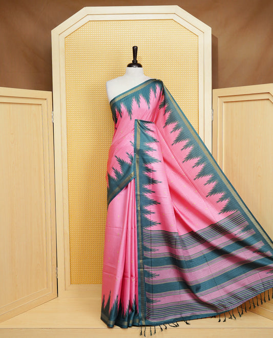 Pink and  Dark Green Colour Kattan silk saree featuring buttas all over the body, a temple-designed border &  a contrasting striped pallu with tassels. Paired with a matching contrast-striped blouse piece.