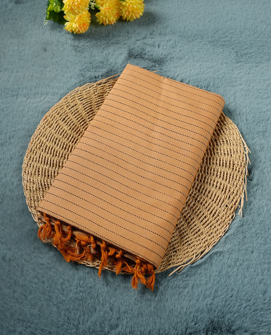 Pastel Orange colour poly cotton saree with black vertical dotted line pattern on the body, paired with a matching pallu featuring black zigzag geometric border, and a coordinated all‑over black stylised fleur‑de‑lis printed blouse piece.