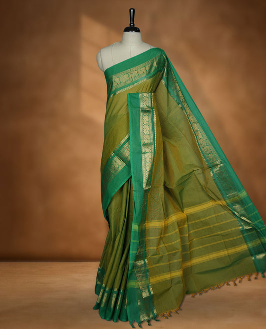 Lemon colour chettinad cotton saree featuring plain body, contrast Green colour with traditional gold zari border paired with matching blouse.