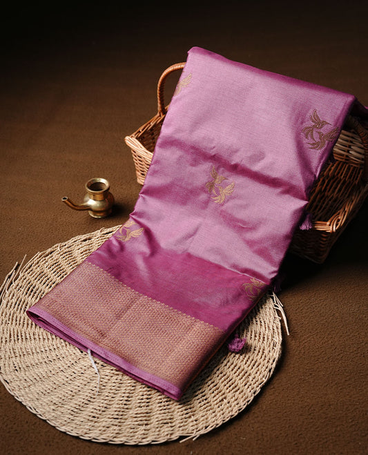 China rose colour semi banaras tussar silk saree highlighting gold zari bird motifs on body, complemented by self colour with antique zari border, paired with matching blouse piece.