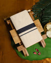 Classic off white colour pure cotton double dhoti featuring a bold navy blue border with fine detailing & A refined traditional attire, perfect for weddings, rituals, and cultural festivities.