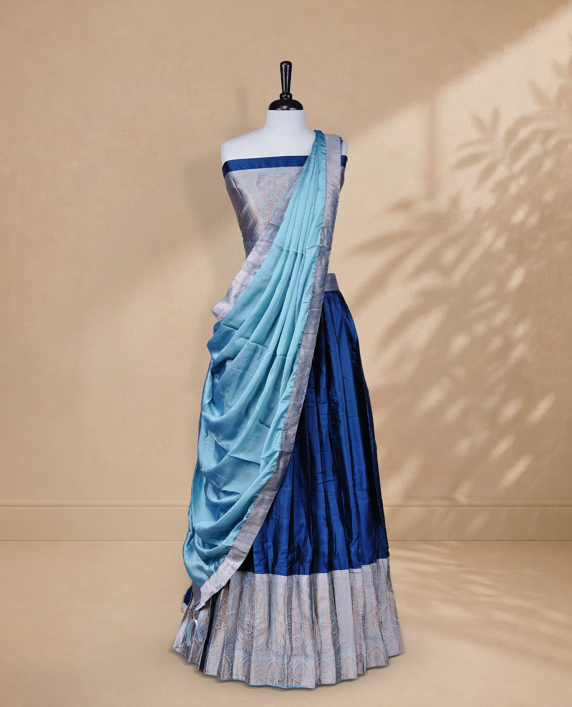 Teal Blue colour Half saree featuring Plain skirt with Zari border on contrast Aqua colour border, Unstitched Blouse and matching dupatta.