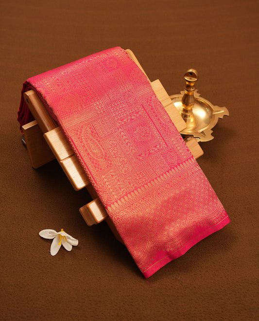 Rani Pink colour semi silk brocade saree featuring intricate Gold patterns across the body, complemented by a Self colour woven border and pallu, paired with a matching blouse.