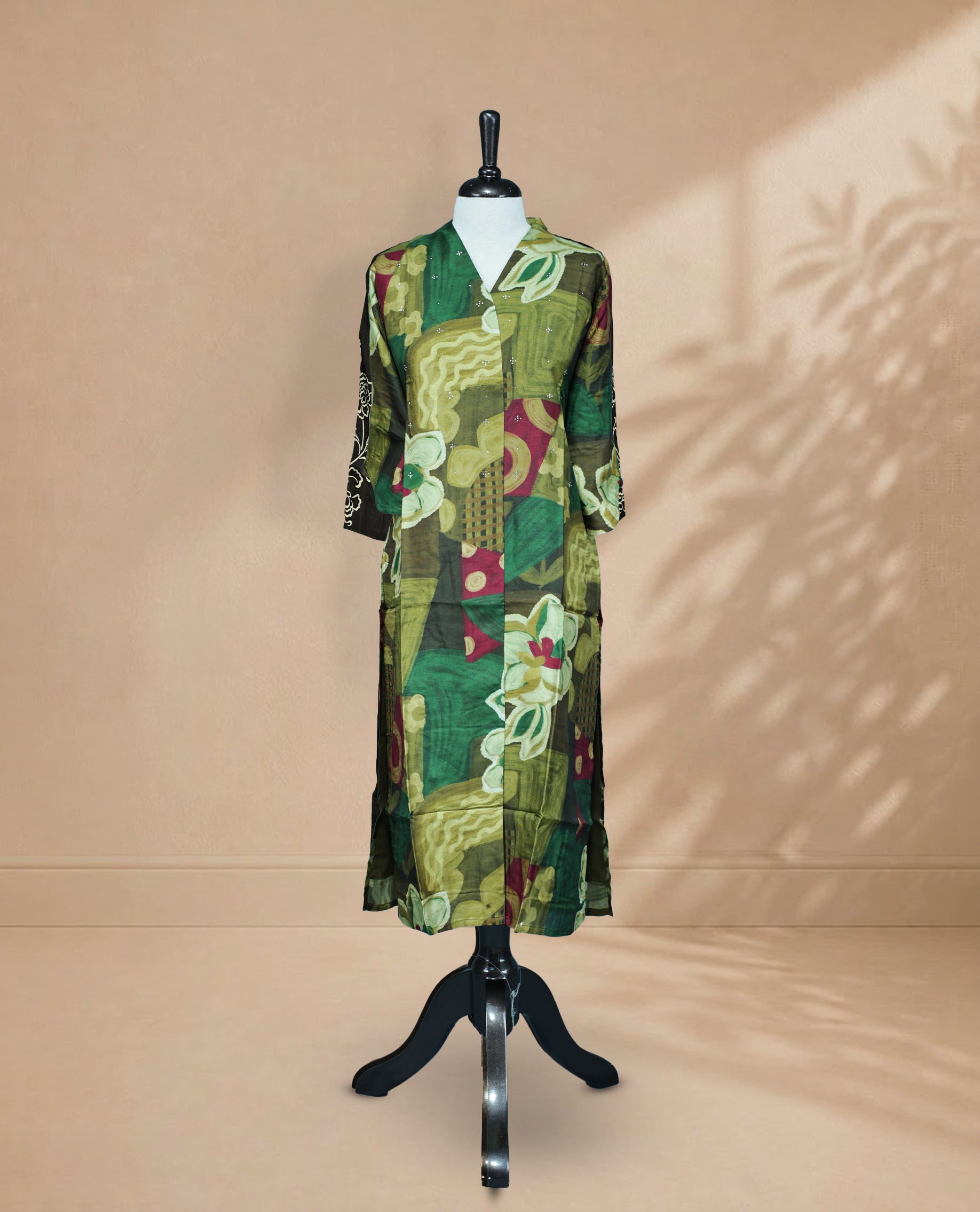 Multi Colour Kurti featuring an abstract Digital print On Body , a V-neckline, subtle Stone detailing, and 3/4 sleeves.
