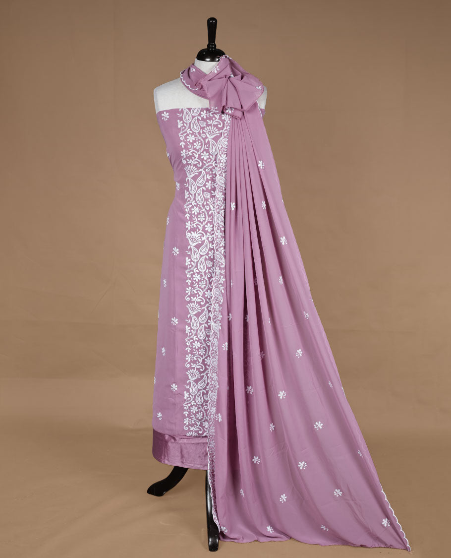 pink colour churidar material featuring white thread floral pattern on body, paired with matching bottom and dupatta.