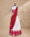 Cream colour Half saree featuring Gold zari buttas on skirt with Zari border on contrast Red colour border, Unstitched Blouse and matching dupatta.