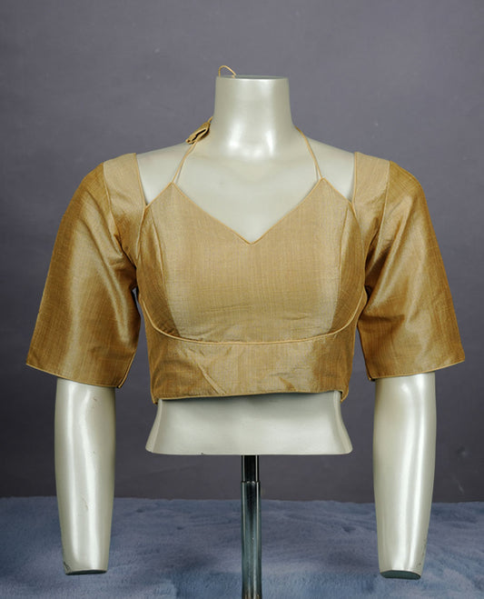 Cream colour silk padded readymade blouse with elbow-length sleeves, a V-neck front, and a deep U-back with tie-up dori.