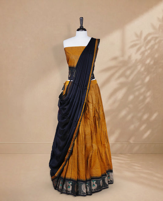 Mustard colour Half saree featuring Plain skirt with Zari border on contrast black colour border, Unstitched Blouse and matching dupatta.