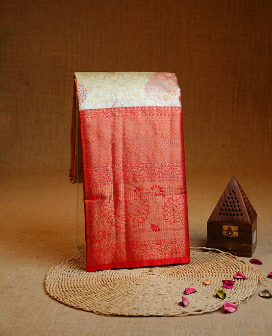 Light gold  colour Semi tissue silk saree featuring Gold zari kodi & Red zari Motifs on body, Contrast Red colour with traditional border, paired with matching.