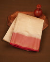 Cream colour tussar silk saree featuring elegant plain body, contrast Red colour border with gold zari, comes with matching blouse piece.