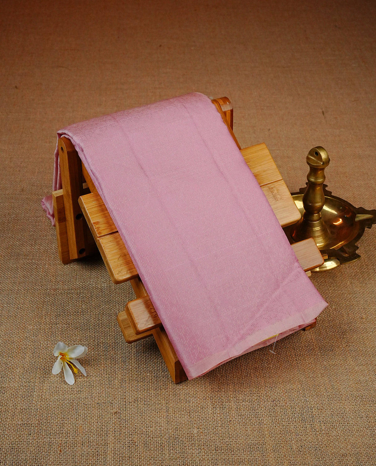 Baby Pink Colour soft silk saree featuring elegant self woven leaf motifs across the body, complemented by a richly woven self design pallu, paired with a matching plain blouse piece.