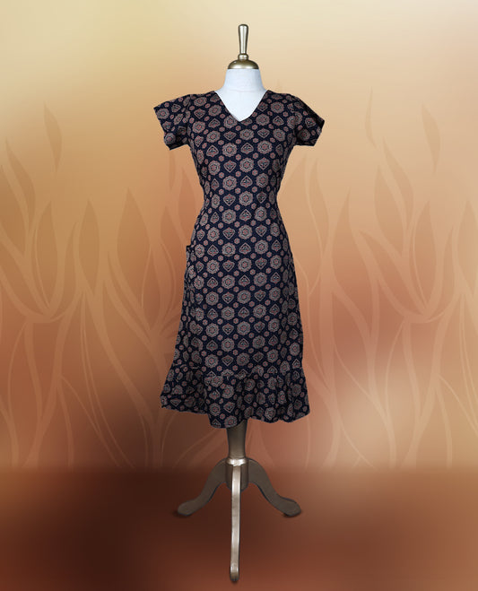 Black colour nightwear adorned with soft maroon floral prints, featuring a V neckline, short sleeves, and a flared ruffle hem, A stylish and comfortable choice for daily wear, brunches, or casual outings.