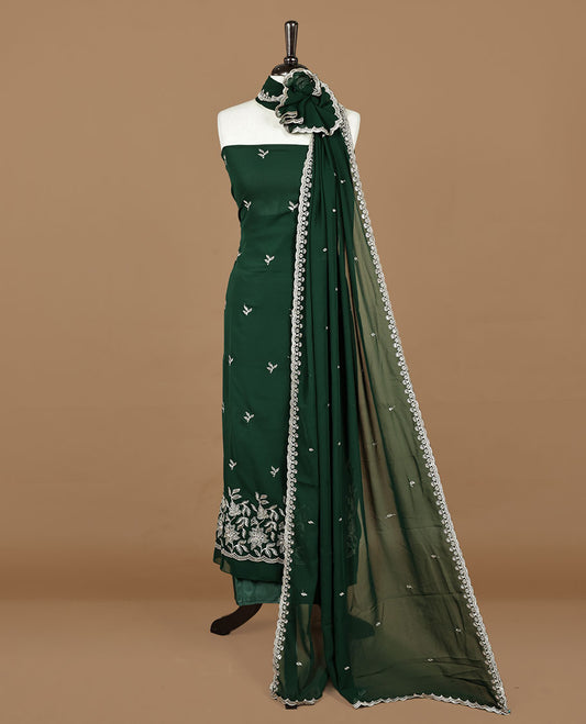 Green colour churidhar material featuring gold thread floral pattern on body, paired with matching bottom & dupatta.
