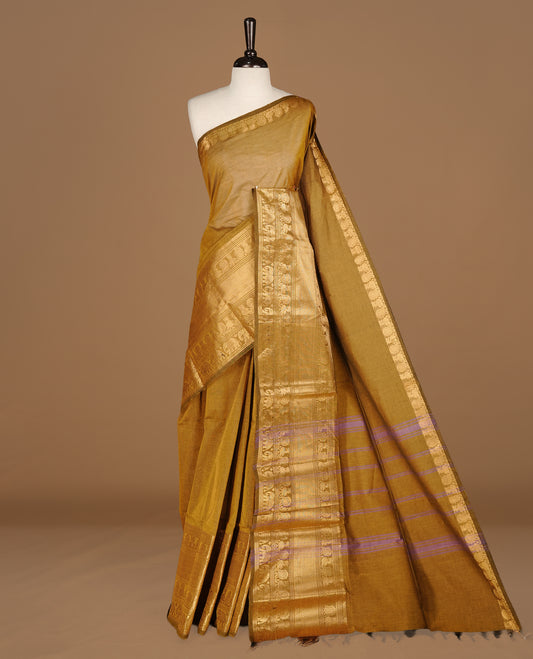 Warm Olive Colour chettinad cotton saree featuring Elegant plain body, complemented by self colour with gold zari border, paired with matching blouse.