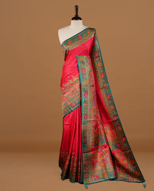 Pink colour Pashmina Saree featuring a plain lustrous body, a multicolour traditional woven border, a rich traditional woven pallu with temple and floral motifs, paired with a matching blouse.