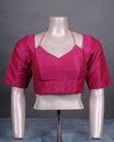 Magenta colour silk padded readymade blouse with elbow-length sleeves, a V-neck front, and a deep U-back with tie-up dori.