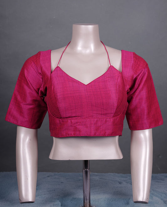 Magenta colour silk padded readymade blouse with elbow-length sleeves, a V-neck front, and a deep U-back with tie-up dori.