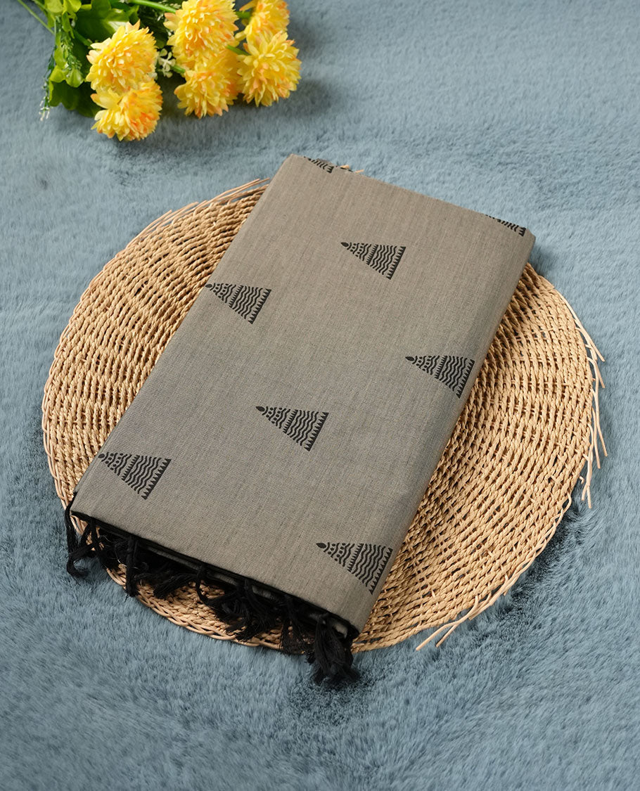 Gray colour poly cotton saree with black temple motifs on the body, paired with a matching with black woven traditional border, and a coordinated all‑over geometric printed blouse piece.