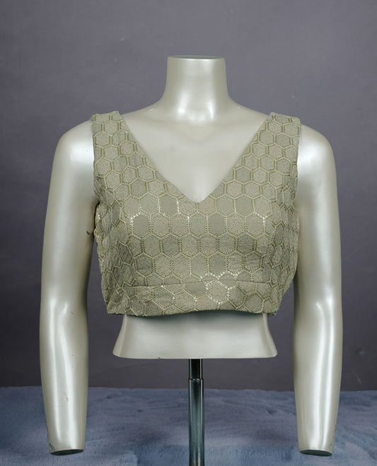 Laurel green colour padded blouse with gold hexagon weave, sleeveless V-neck, and deep V-back with tie-up tassels.