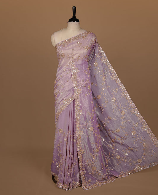 Pastel purple colour net organza saree featuring cut beats and sequins floral kodi pattern on body, enhanced with worked border and cut beats work on blouse piece.