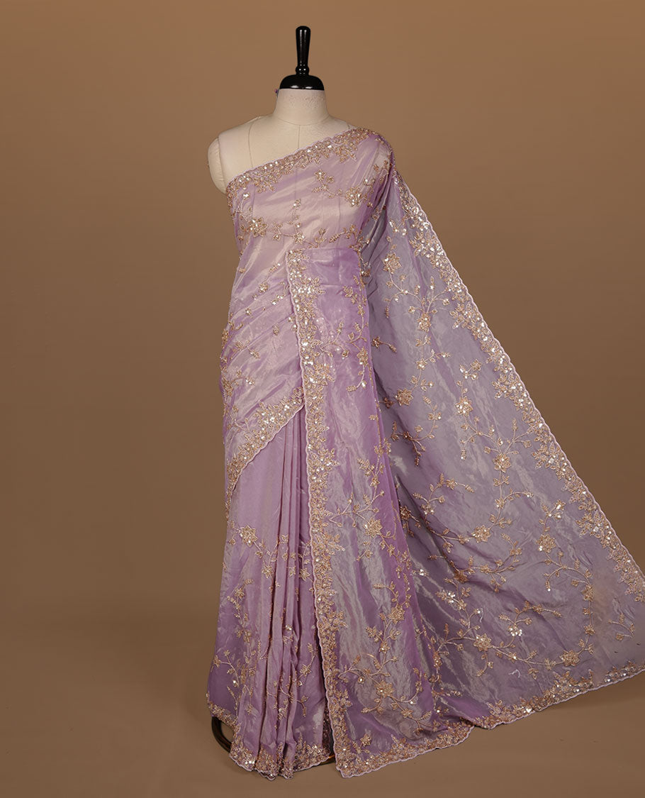 Pastel purple colour net organza saree featuring cut beats and sequins floral kodi pattern on body, enhanced with worked border and cut beats work on blouse piece.