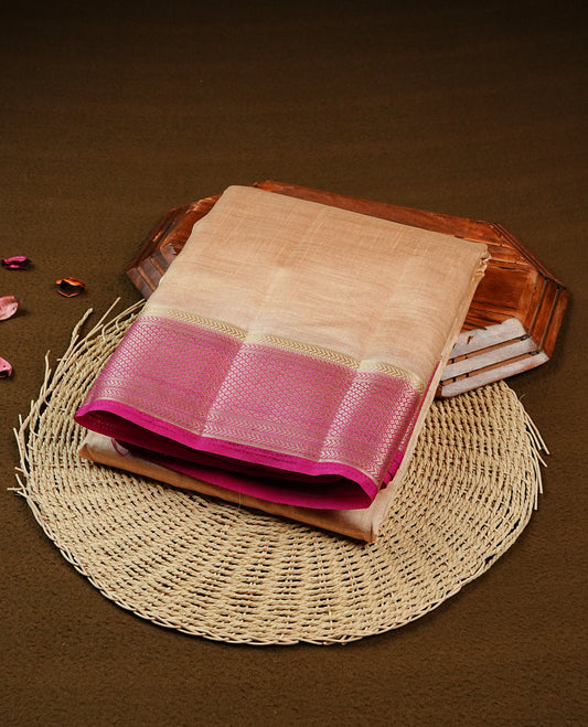 Light Gold Tussar saree featuring Gold zari buttas on body, complemented by contrast Magenta Colour with Gold zari border, comes with matching blouse piece.