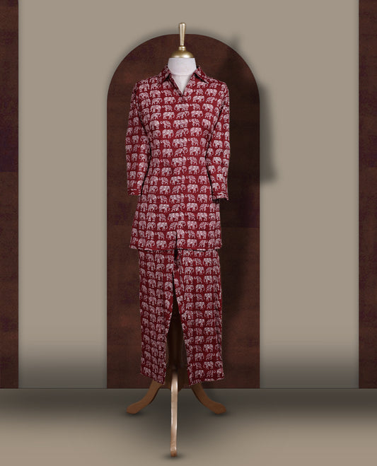 Maroon colour cotton coord set featuring charming elephant prints all over, Designed with a classic shirt collar and 3/4 sleeves, paired with matching straight pants for a trendy, relaxed, and comfy everyday look.