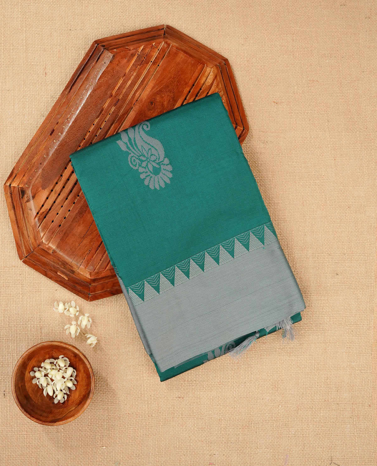 Dark teal colour silk cotton saree featuring ash teal colour thread motifs on body thread detiled contrast borders & pallu,comes with matching blouse piece