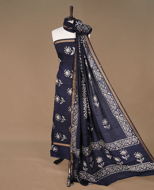Dark blue colour churidhar material featuring cream colour floral kodi print on body, paired with matching bottom and Dupatta.