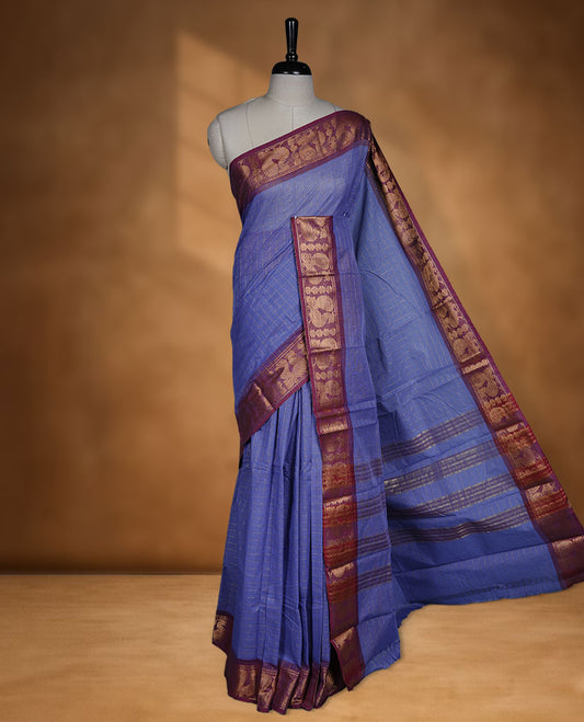 Lavender colour sungudi cotton saree featuring gold zari check pattern across body, contrast Maroon colour with gold zari peacock and floral pattern on border, without blouse piece.