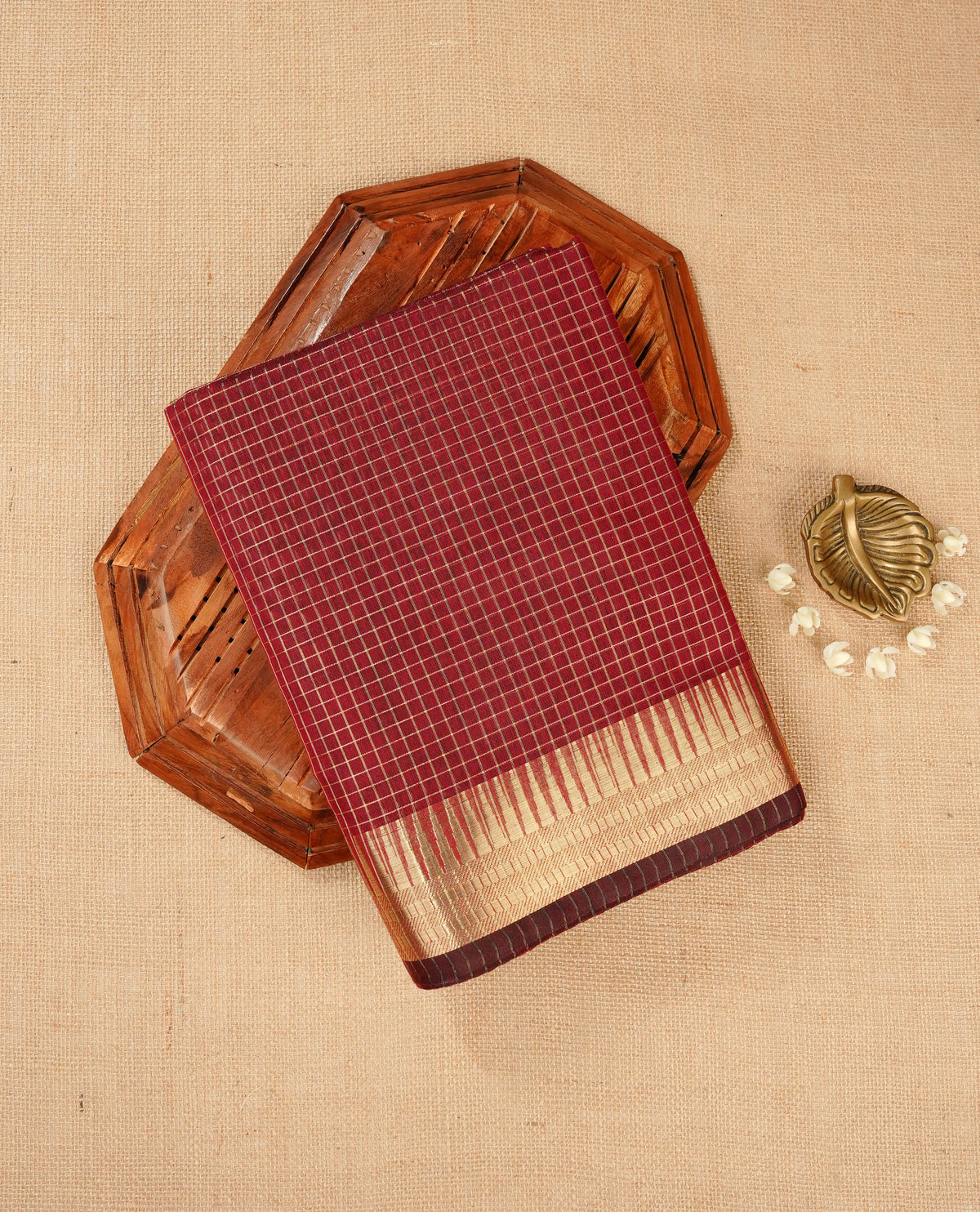 Maroon colour Maheshwari cotton saree, gold zari small checks on body, complement self colour gold zari temple design border comes with matching blouse.